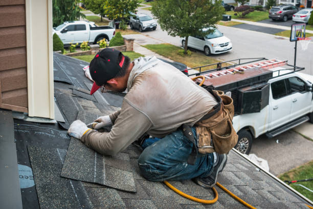 Professional Roofing technician working in Oyster Bay Cove, NY